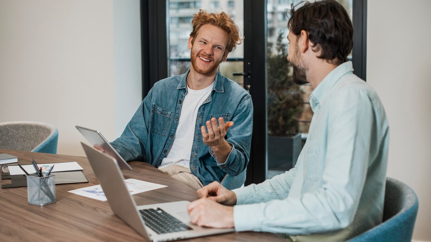 side-view-business-men-talking-indoors_23-2148761288